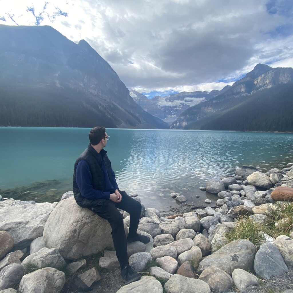 Photo of Jacob looking toward Lake Louise in Alberta, Canada.